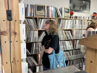 A person browses through records at Tracks on Kirkwood Avenue