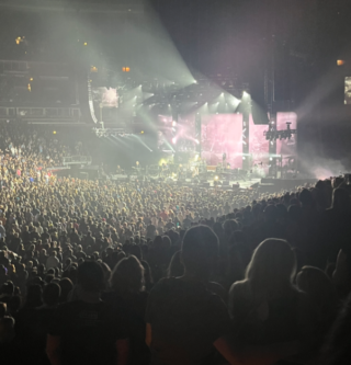 A large crowd watches the stage as The Cure performs in Chicago