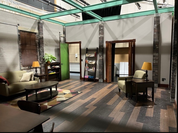 Interior of the Studio 5 apartment set, decorated as a studio apartment.