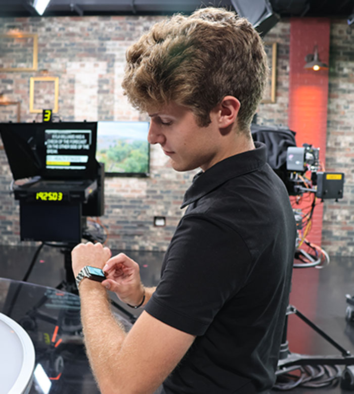 Young man using Apple Watch.