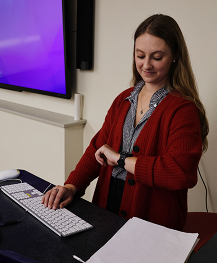 Young woman using Apple Watch.