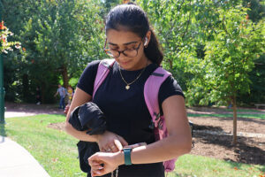 Young female student at IUB uses her Apple Watch