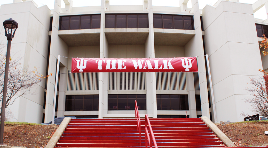 Red Indiana University banner saying "The Walk" taken at one of the entrances to the stadium.