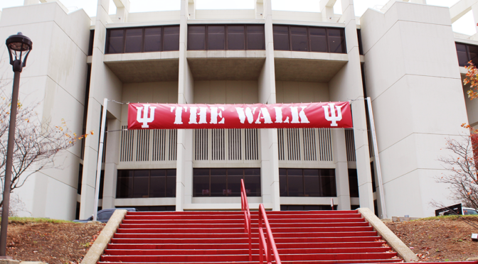 Red Indiana University banner saying "The Walk" taken at one of the entrances to the stadium.