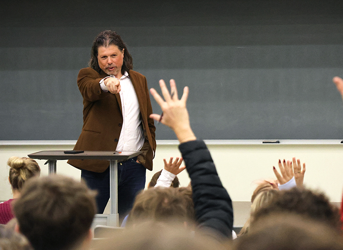 Director of the National Sports Journalism Center and Indiana University Associate Dean Galen Clavio calls on a student during a press conference on NIL deals.