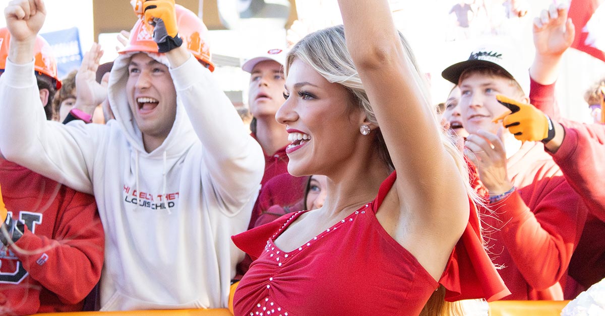 Young woman on the Indiana University Dance Team- The RedSteppers, cheering at College Game Day