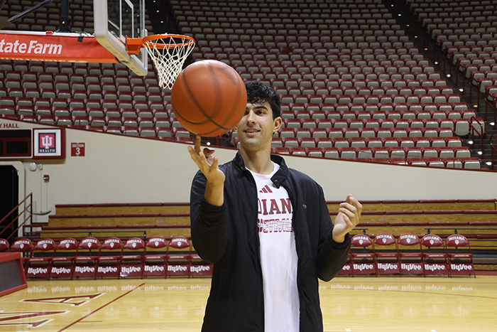 Shaan Burke spins a basketball at Assembly Hall. 