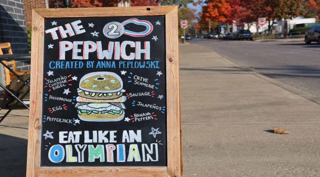 A sign outside Bloomington Bagel Company advertises a athlete meal