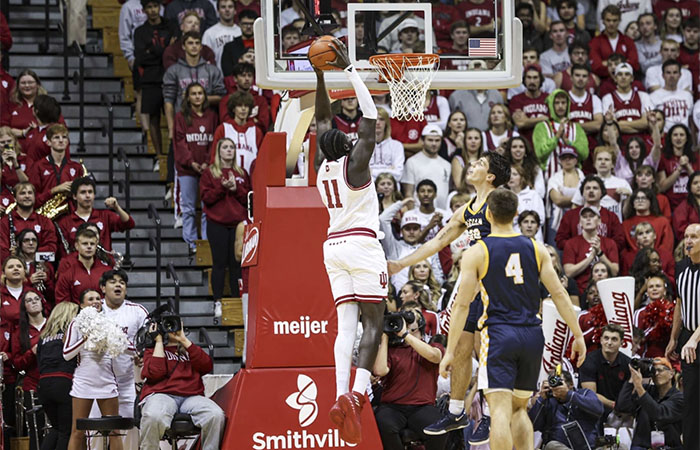 Basketball player scores points.