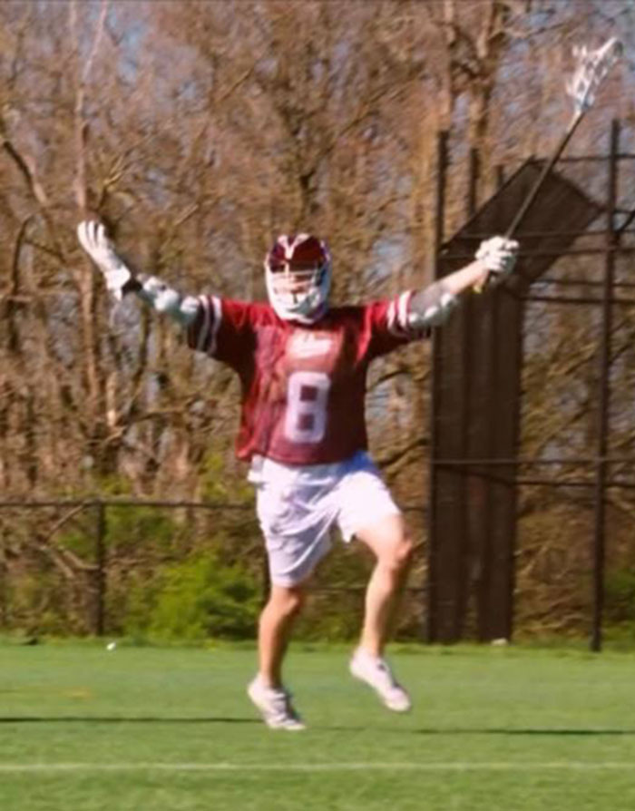 Peter Faust, a club lacrosse player at IU, celebrates on the field.