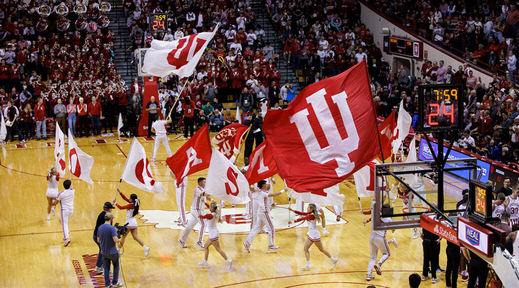 Indiana University shows their pride at a basketball game with IU flags.