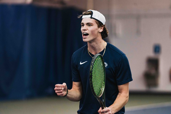 Nolan Ranger pumps his fist and shouts at a tennis match.