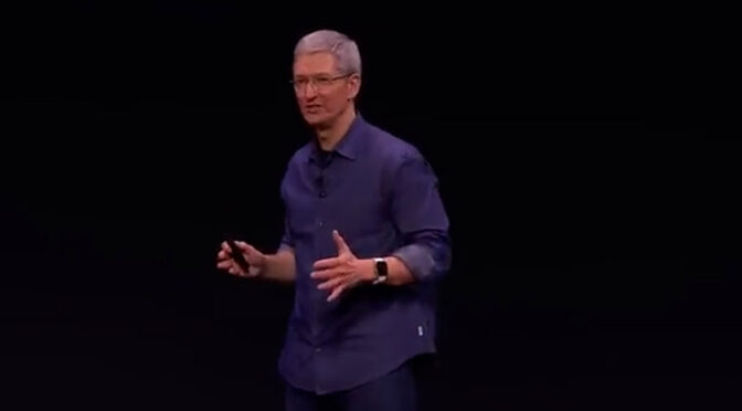 Apple CEO Tim Cook faces crowd.