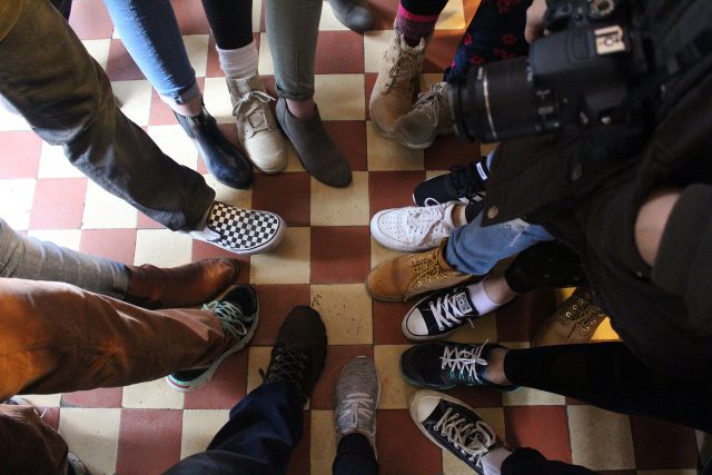 A circle of feet pointing at each other