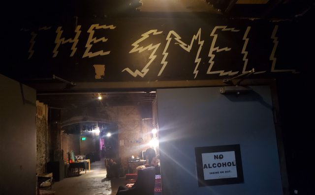 The inside of The Smell music venue. There's a poster that says "No Alcohol inside or out."