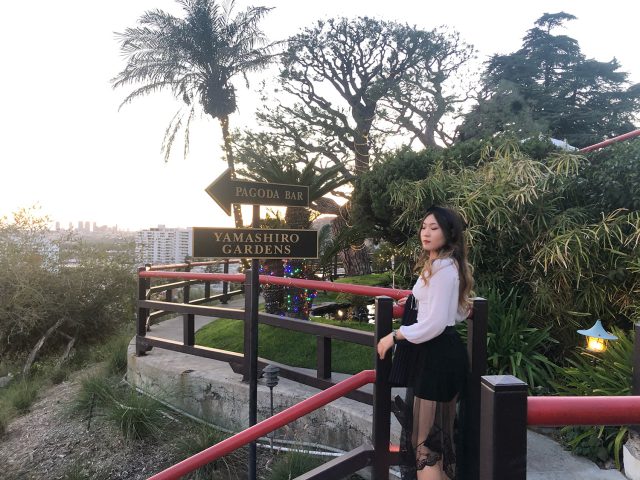 Sara Sun standing at the top of a hill at Yamashiro Gardens