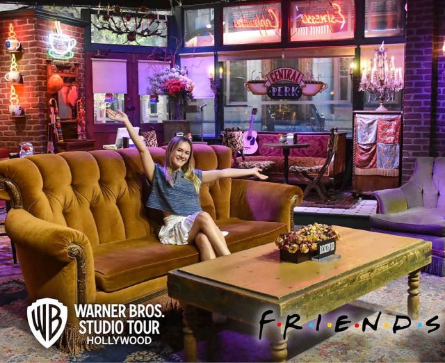 Katie Leffers poses on the "Friends" coffeeshop set.